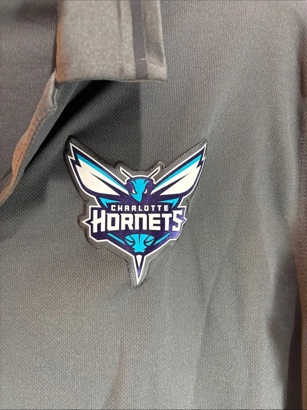 Jordan Black Charlotte Hornets Polo with White Jumpman. 0189
